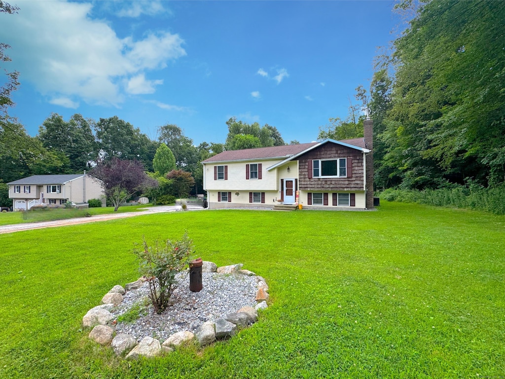 406 Windham Ave, Colchester, CT 06415 - bi-level home with a chimney and a front lawn