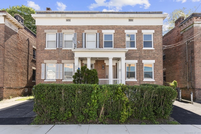 276 Bond St, Bridgeport, CT 06610 - view of front facade featuring brick siding