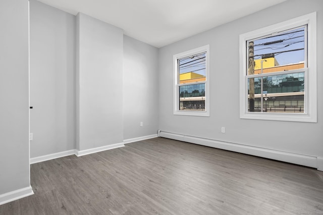 276 Bond St, Bridgeport, CT 06610 - spare room with a baseboard radiator and wood finished floors