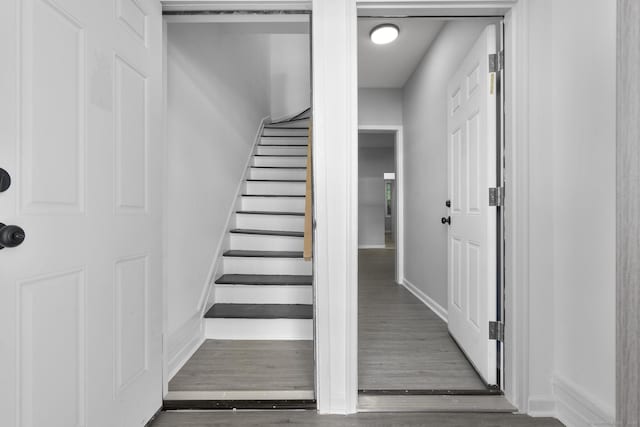 276 Bond St, Bridgeport, CT 06610 - stairs featuring baseboards and wood finished floors