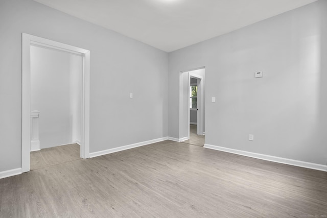 276 Bond St, Bridgeport, CT 06610 - unfurnished room with wood finished floors and baseboards