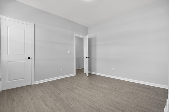 276 Bond St, Bridgeport, CT 06610 - unfurnished bedroom with wood finished floors and baseboards