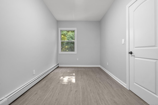 276 Bond St, Bridgeport, CT 06610 - empty room featuring a baseboard radiator and wood finished floors