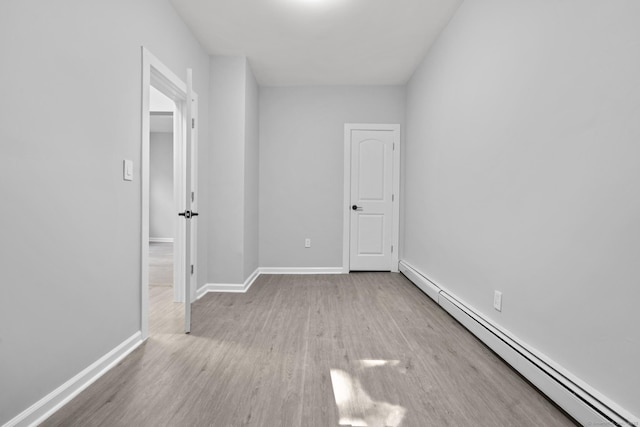 276 Bond St, Bridgeport, CT 06610 - unfurnished room with a baseboard radiator and wood finished floors