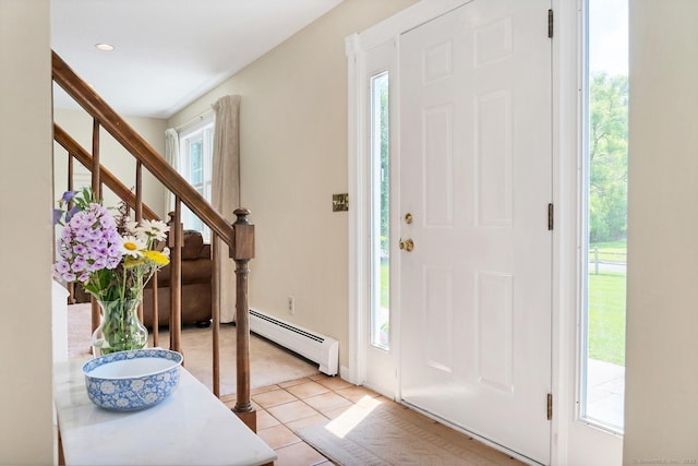 35 Pheasant Ln, Ridgefield, CT 06877 - entrance foyer featuring baseboard heating, light tile patterned floors, and stairway