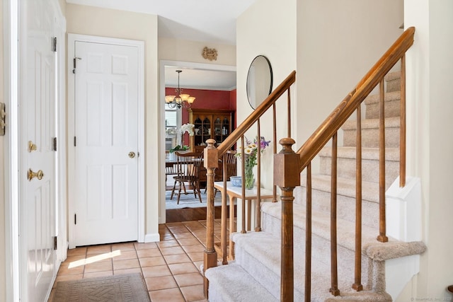35 Pheasant Ln, Ridgefield, CT 06877 - entryway with light tile patterned floors, stairway, and a chandelier