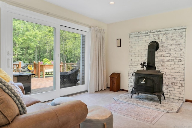 35 Pheasant Ln, Ridgefield, CT 06877 - carpeted living area featuring a wood stove and baseboards