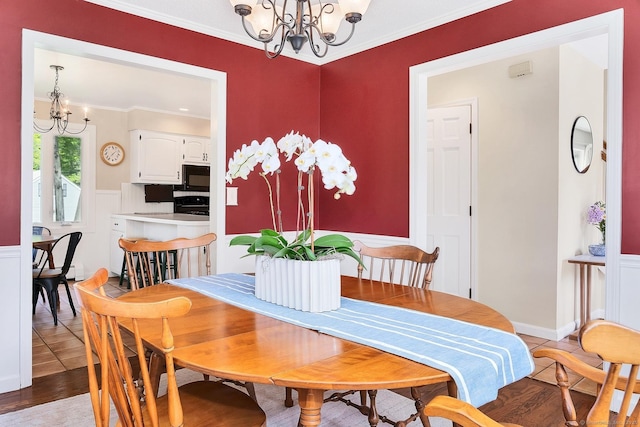 35 Pheasant Ln, Ridgefield, CT 06877 - dining area with a chandelier, crown molding, and light wood-style flooring