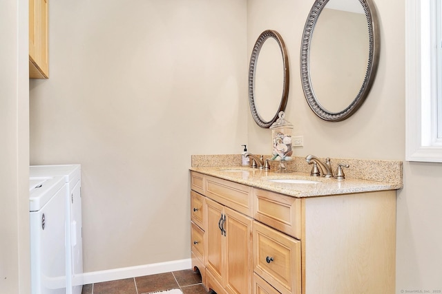 35 Pheasant Ln, Ridgefield, CT 06877 - full bathroom with washer and clothes dryer, double vanity, and tile patterned floors