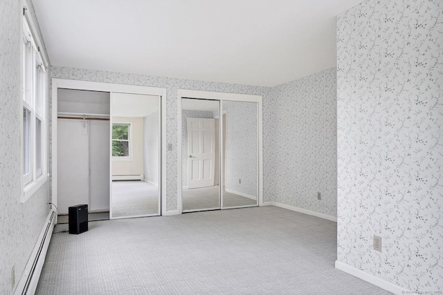 35 Pheasant Ln, Ridgefield, CT 06877 - unfurnished bedroom featuring multiple closets, a baseboard heating unit, wallpapered walls, carpet flooring, and a baseboard radiator