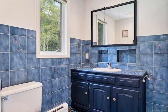 35 Pheasant Ln, Ridgefield, CT 06877 - half bathroom featuring tile walls, vanity, and baseboard heating