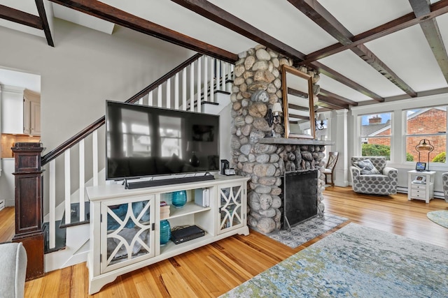 8 Fenbrook Rd, Old Saybrook, CT 06475 - living room featuring beamed ceiling, stairway, wood finished floors, and a fireplace