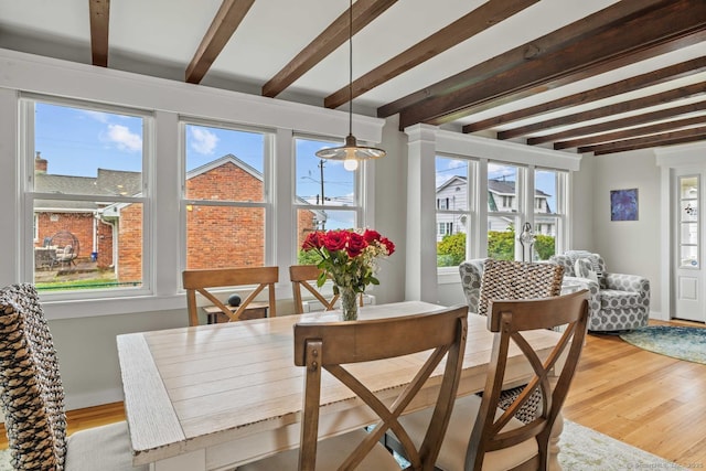 8 Fenbrook Rd, Old Saybrook, CT 06475 - dining space featuring beamed ceiling, healthy amount of natural light, and light wood-style flooring