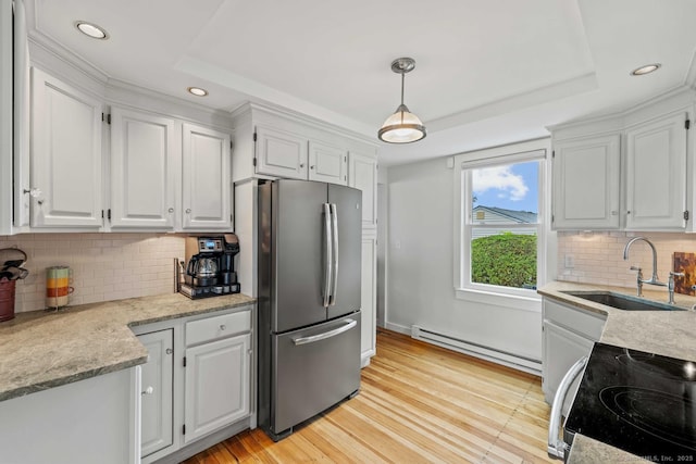 8 Fenbrook Rd, Old Saybrook, CT 06475 - kitchen with a raised ceiling, range with electric stovetop, baseboard heating, freestanding refrigerator, and recessed lighting