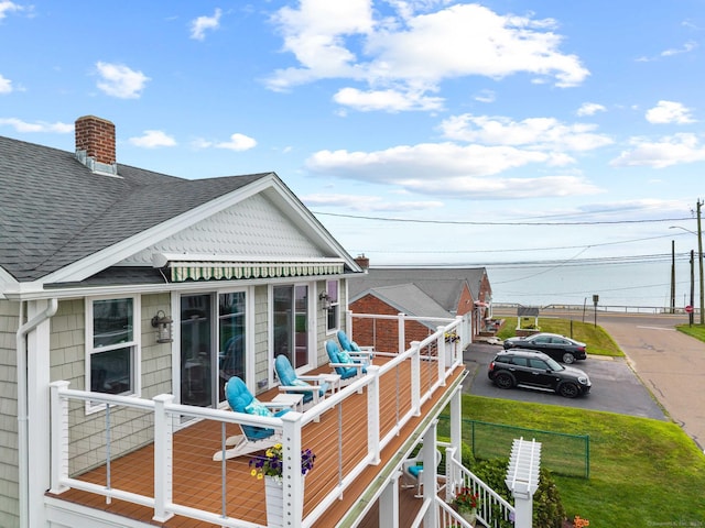 8 Fenbrook Rd, Old Saybrook, CT 06475 - view of home's exterior with a shingled roof, a chimney, and a balcony