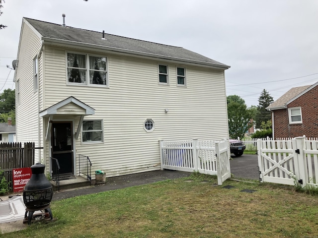 74 Brussels Ave, Wethersfield, CT 06109 - back of property featuring roof with shingles