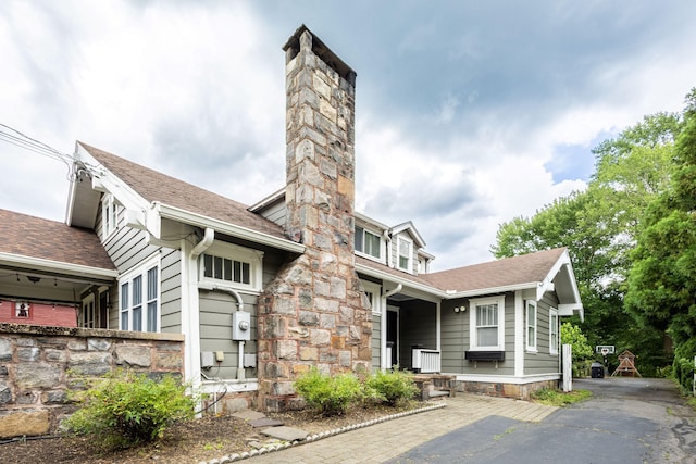 336 Main St, Wethersfield, CT 06109 - view of front facade featuring a chimney and roof with shingles