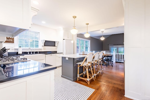 336 Main St, Wethersfield, CT 06109 - kitchen featuring white appliances, white cabinets, a center island, and recessed lighting