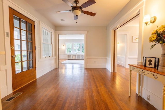 336 Main St, Wethersfield, CT 06109 - foyer featuring dark wood-style floors, ceiling fan, and wainscoting