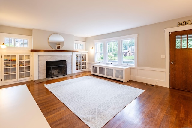 336 Main St, Wethersfield, CT 06109 - living room with dark wood-type flooring and a fireplace
