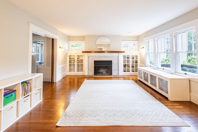 336 Main St, Wethersfield, CT 06109 - unfurnished living room featuring dark wood finished floors and a fireplace