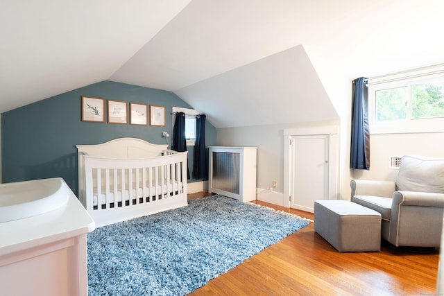 336 Main St, Wethersfield, CT 06109 - bedroom with wood finished floors and vaulted ceiling