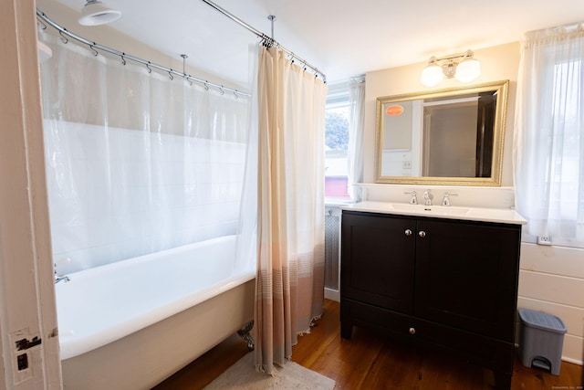 336 Main St, Wethersfield, CT 06109 - full bath with wood finished floors, plenty of natural light, vanity, and shower / tub combo