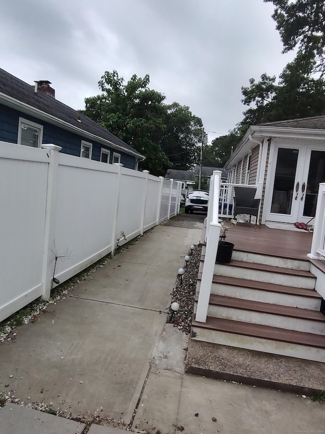 191 Dawson Ave, West Haven, CT 06516 - view of patio featuring a deck, driveway, and french doors