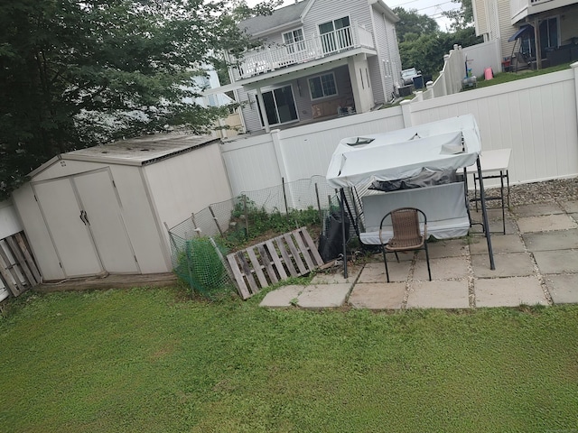 191 Dawson Ave, West Haven, CT 06516 - fenced backyard featuring a patio area and a storage unit
