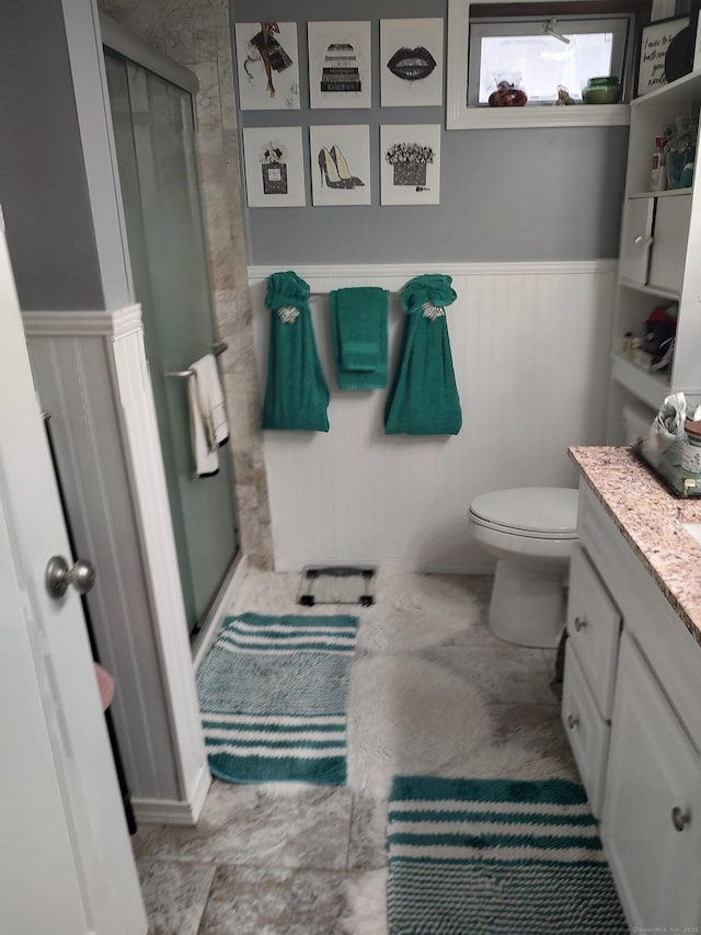 191 Dawson Ave, West Haven, CT 06516 - full bathroom featuring vanity, a stall shower, and a wainscoted wall