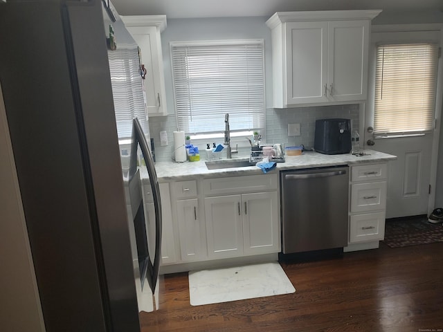 191 Dawson Ave, West Haven, CT 06516 - kitchen featuring freestanding refrigerator, dishwasher, white cabinets, backsplash, and dark wood-type flooring