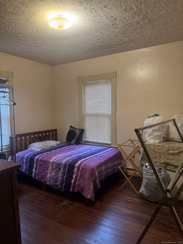 32 Lenox St, Hartford, CT 06154 - bedroom with wood-type flooring, a textured ceiling, and baseboard heating