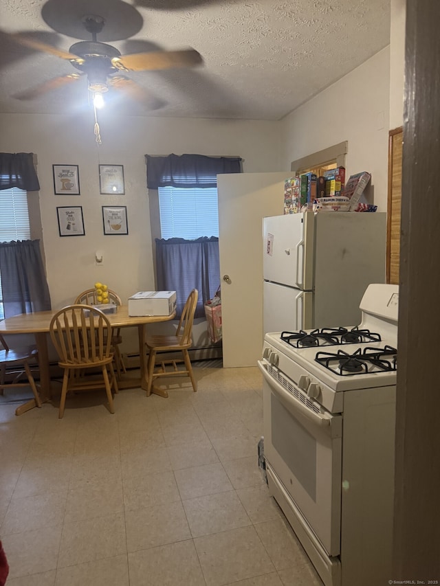 32 Lenox St, Hartford, CT 06154 - kitchen featuring white appliances, a textured ceiling, ceiling fan, and light tile patterned flooring