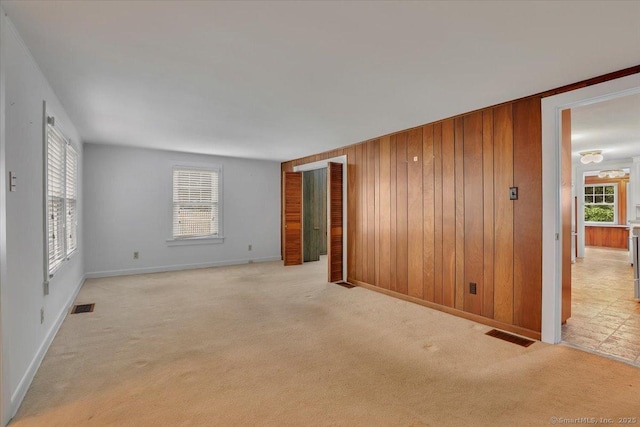 496 Mulberry St, Southington, CT 06479 - spare room featuring light carpet and wooden walls