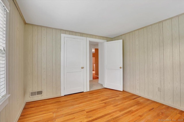 496 Mulberry St, Southington, CT 06479 - empty room with light wood-type flooring and wood walls
