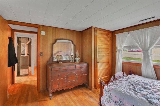 496 Mulberry St, Southington, CT 06479 - bedroom featuring light wood finished floors, wooden walls, and heating unit