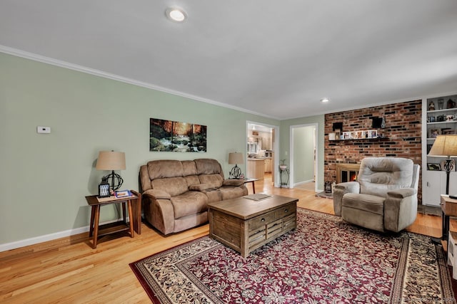 159 Woods Way Dr, Southbury, CT 06488 - living room featuring a fireplace, ornamental molding, light wood-style floors, and recessed lighting