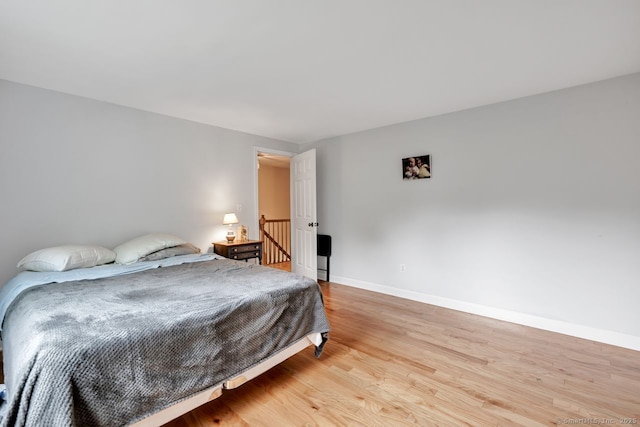 159 Woods Way Dr, Southbury, CT 06488 - bedroom with light wood-style floors and baseboards