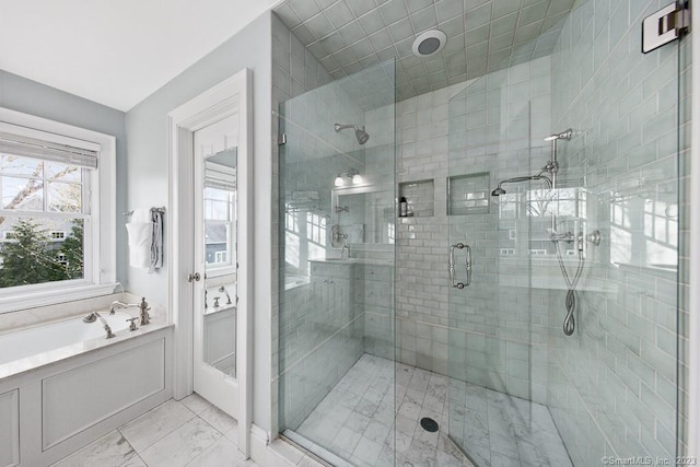 81 Birch Rd, Fairfield, CT 06824 - bathroom featuring a stall shower, marble finish flooring, and a garden tub
