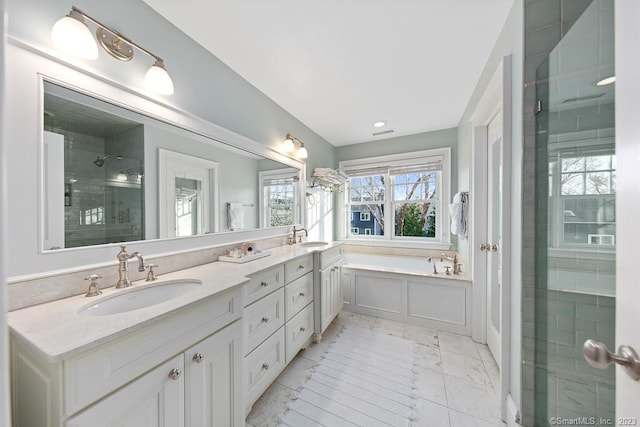 81 Birch Rd, Fairfield, CT 06824 - bathroom featuring a shower stall, marble look tiles, double vanity, and a bath