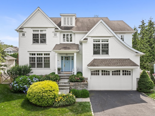 81 Birch Rd, Fairfield, CT 06824 - shingle-style home with roof with shingles, an attached garage, and asphalt driveway