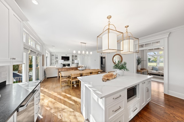 81 Birch Rd, Fairfield, CT 06824 - kitchen featuring open floor plan, a kitchen island, white cabinetry, wood finished floors, and recessed lighting