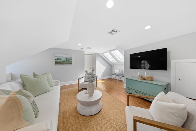 81 Birch Rd, Fairfield, CT 06824 - living room featuring a skylight, wood finished floors, recessed lighting, and vaulted ceiling