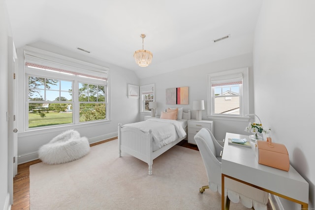 81 Birch Rd, Fairfield, CT 06824 - bedroom with a chandelier, wood finished floors, and vaulted ceiling