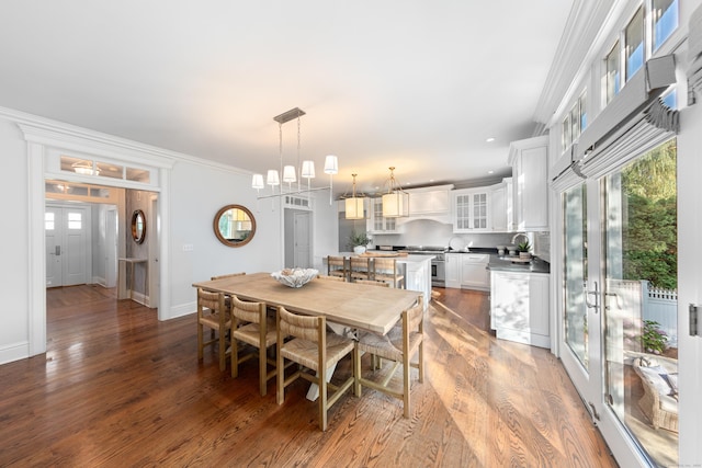 81 Birch Rd, Fairfield, CT 06824 - dining area featuring wood finished floors, plenty of natural light, french doors, and crown molding