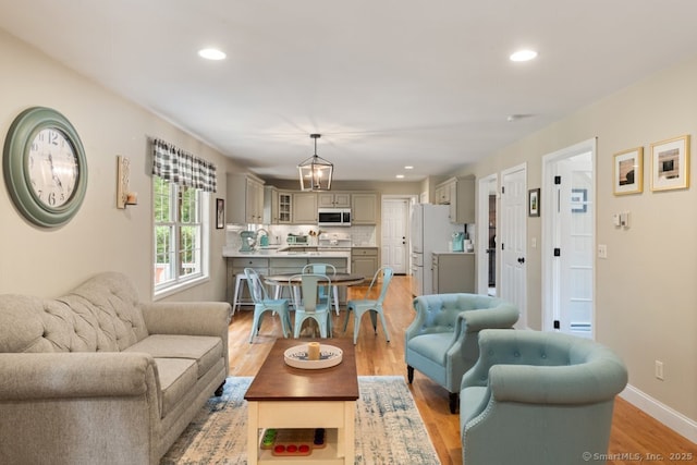 26 Philo Curtis Rd, Newtown, CT 06482 - living area with light wood-style floors and recessed lighting