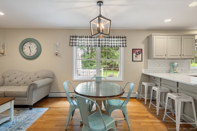 26 Philo Curtis Rd, Newtown, CT 06482 - dining area featuring plenty of natural light, recessed lighting, light wood-style flooring, and a baseboard radiator
