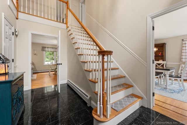 26 Philo Curtis Rd, Newtown, CT 06482 - stairs featuring granite floors and a baseboard radiator