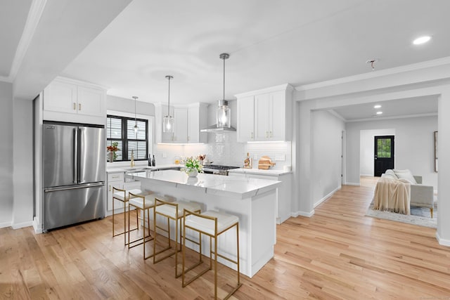 226 Ruane St, Fairfield, CT 06824 - kitchen featuring freestanding refrigerator, tasteful backsplash, light wood-style flooring, wall chimney range hood, and white cabinets