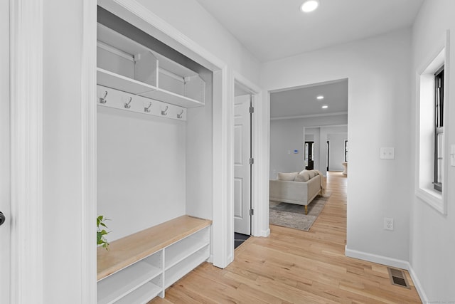 226 Ruane St, Fairfield, CT 06824 - mudroom featuring light wood-style floors and recessed lighting